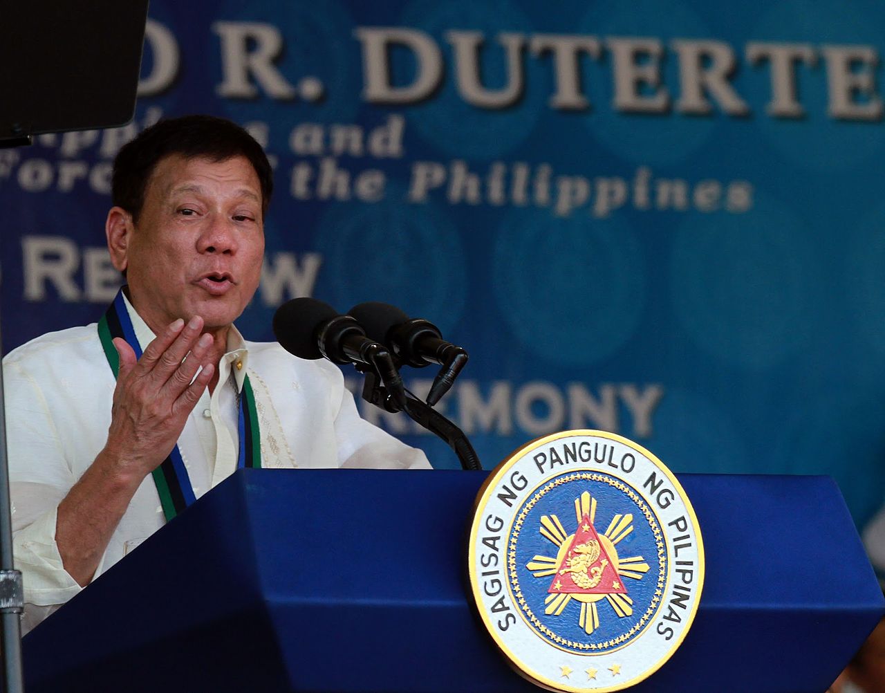 Former Philippine president Rodrigo Duterte delivers a speech from a lectern.